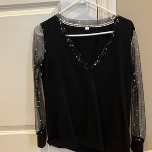 Two cute black and silver tops.